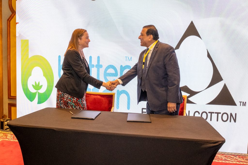 Rachel Beckett, Senior Programme Manager at Better Cotton, shakes hands with Khaled Schuman, Executive Director of Cotton Egypt Association, at a multi-stakeholder event in Cairo celebrating the two organisations' renewed strategic partnership.